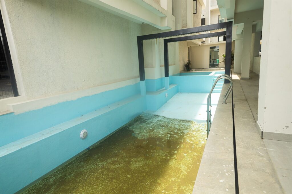 Brum Height 7: Pool deck and water feature beside the swimming pool